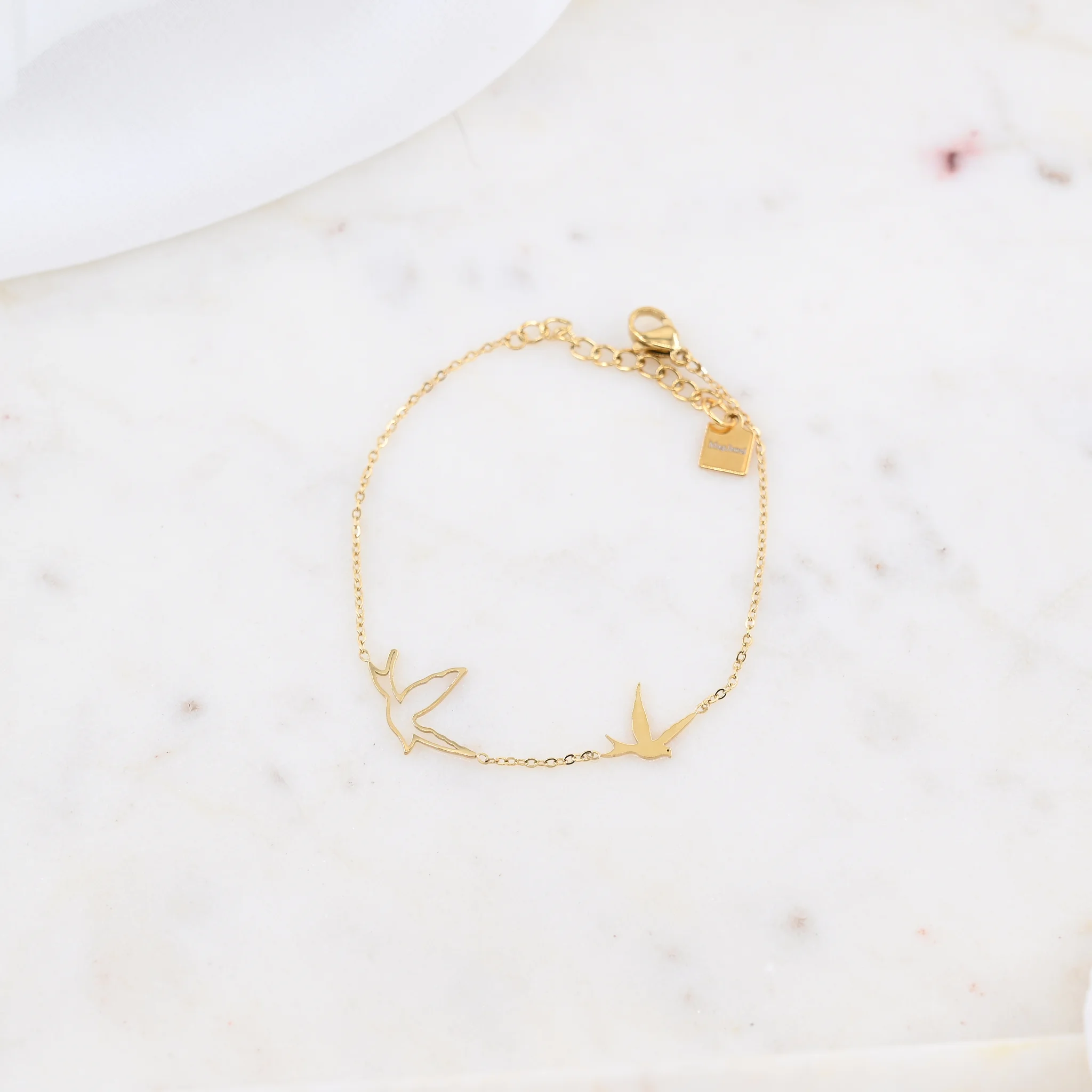 Armbandje met gelinkte vogels